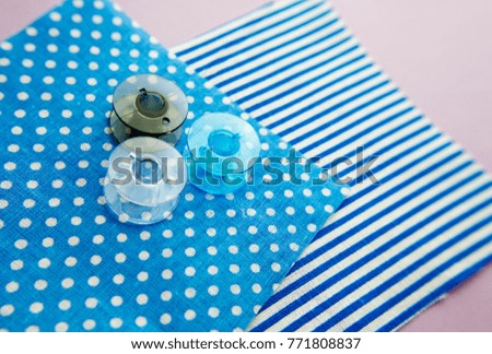 bobince sewing machine to thread on fabric with polka dots and stripes