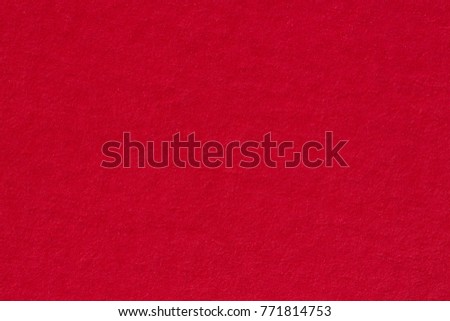 Red paper texture useful as a background. High resolution photo.