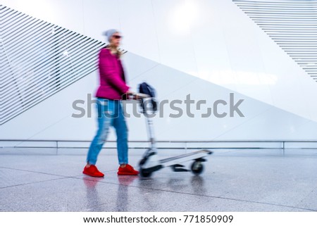 passenger in the walking at the airport - motion blur