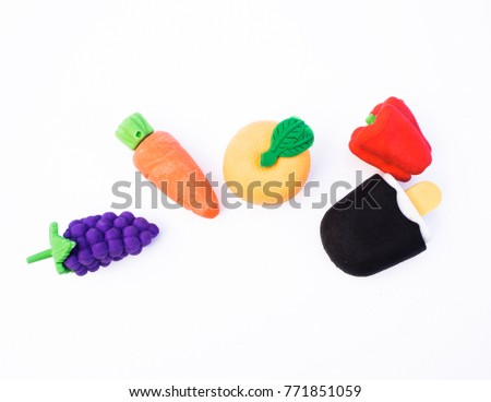 Colored and fruit scented rubber erasers isolated on white
