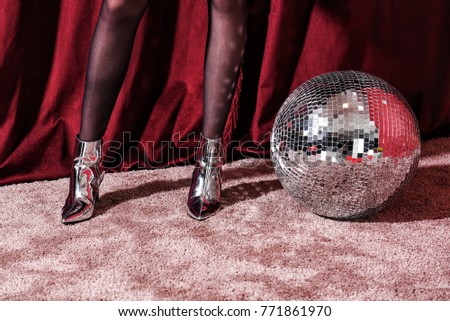 silver boots and disco ball