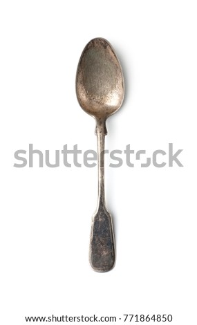 An old shabby tablespoon in a classic style. Isolated on white background.
