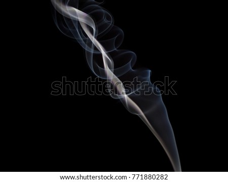 Smoke from incense stick on black background