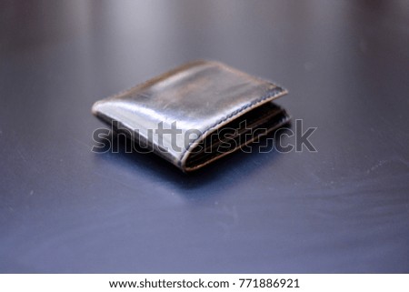 Leather Wallet on dark surface 