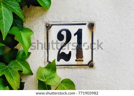 number 21 house number on the wall twenty one