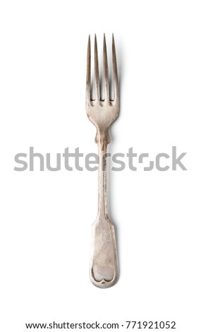 An old worn fork in a classic style. Isolated on white background.
