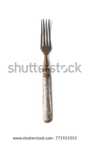Old rusty dessert fork in a classic style. Isolated on white background.
