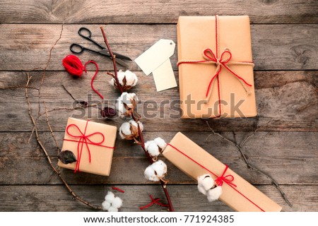 Composition with parcel gift boxes on wooden background