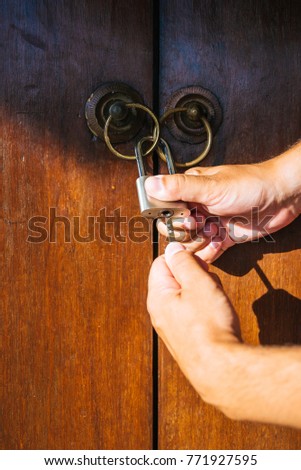 Man is trying to open an old door background texture