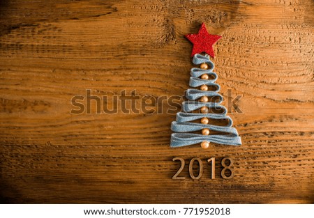 Sigh symbol Christmas Tree, lace and red star toy on old retro vintage style wooden texture background. Empty copy space for inscription. Idea of merry new year 2018 holiday