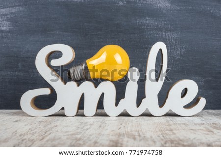 "Smile" tab on the table on a dark background