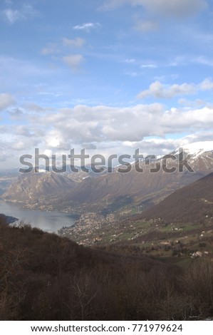 Panoramic image of Valcamonica with Lake Iseo and in the background the snow-capped mountains - Brescia - Lombardy - Italy 11