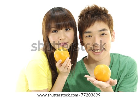 Young asian couple with tropical fruit