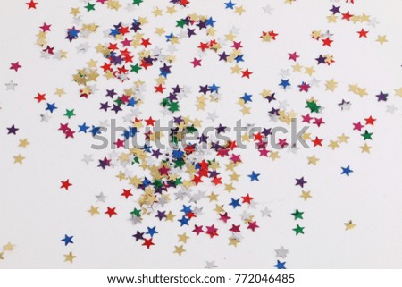 colorful small decoration stars lying in the studio