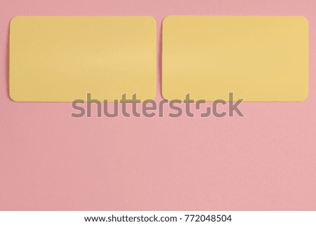 Mock up of two yellow cards on the pink background. The pastel colors photo set.