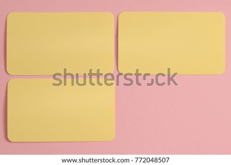 Mock up of three yellow cards on the pink background. The pastel colors photo set.