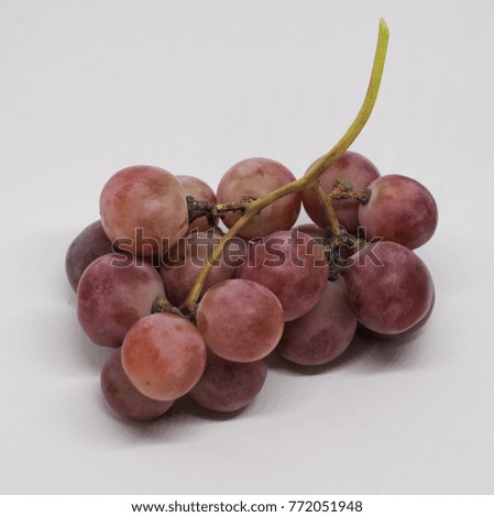 Ripe red grape isolated on white. With clipping path. Full depth of field.

