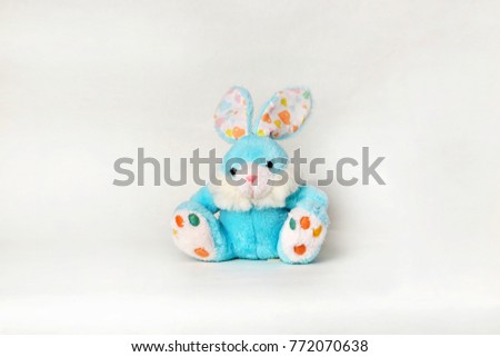 Little cute sitting bunny. Pretty blue rabbit Isolated on white background.