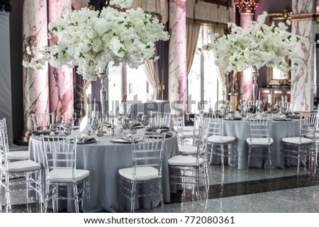 Table sets for wedding or another catered event dinner. Royalty-Free Stock Photo #772080361