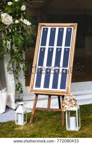 Beautiful elegant stylish wedding guest table list. Royalty-Free Stock Photo #772080433