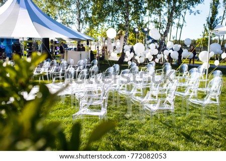 Outdoor wedding ceremony in the forest with large balls. Royalty-Free Stock Photo #772082053