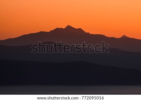 in the background the highest mountain on the Mediterranean island of Elba at sunset