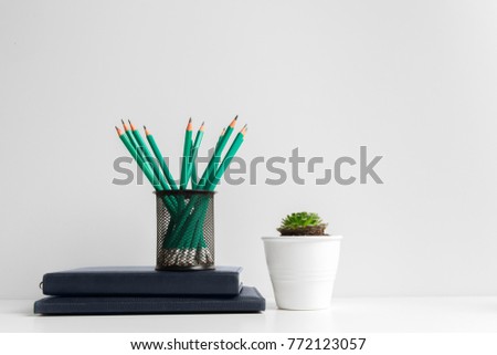 Green pencils in a holder,school supplies