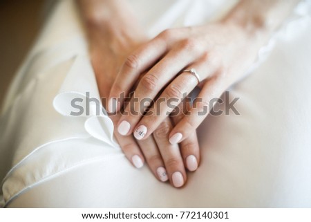 Engagement ring on bride's finger. Wedding day. Royalty-Free Stock Photo #772140301