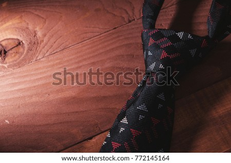 necktie on wooden table