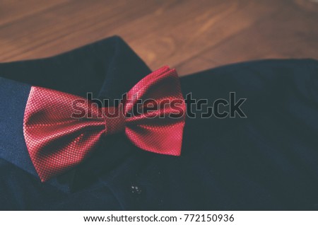 Red bow tie with black shirt 