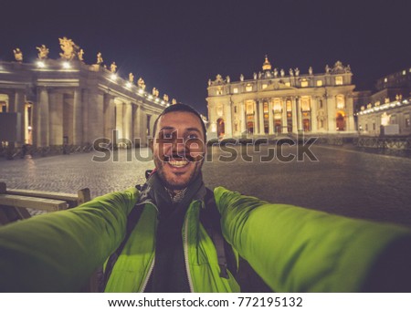 tourist in Rome, Italy. Man take selfie with the facade of the Basilica of Saint Peter, in Vatican City, Italy