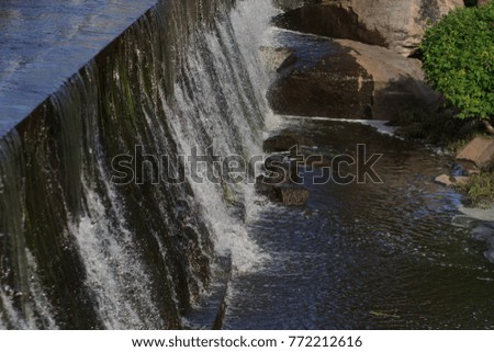 Water from the waterfall as a backdrop