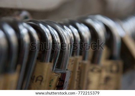 Many padlocks with names of lovers