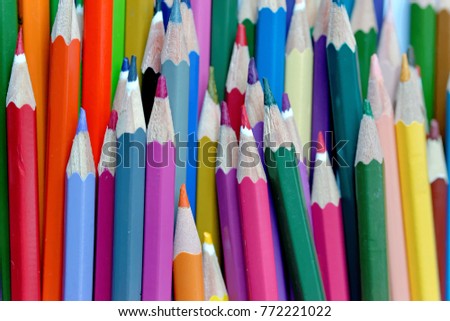 Background of color pencils in a variety of colors.