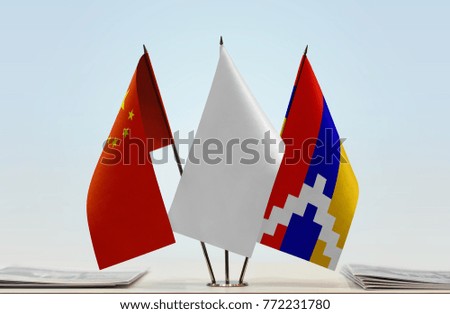 Flags of China and Nagorno-Karabakh with a white flag in the middle
