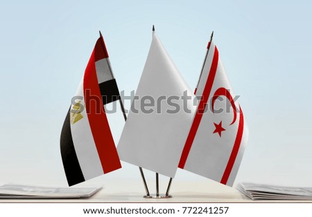 Flags of Egypt and Northern Cyprus with a white flag in the middle