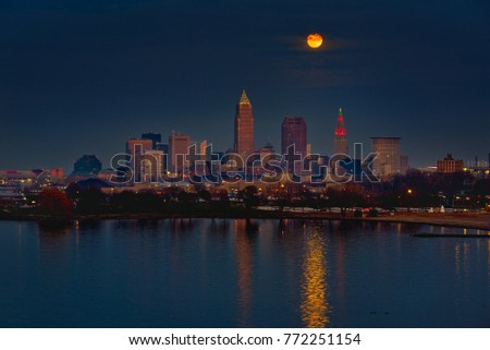 The December full moon high above downtown Cleveland, Ohio