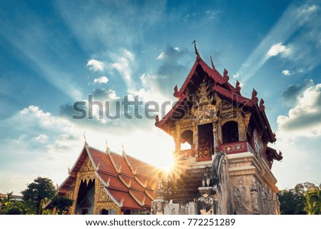 Buddhist Phra Singh Temple at amazing sunset. Tourists favorite landmark in Chiang Mai city centre, Thailand.