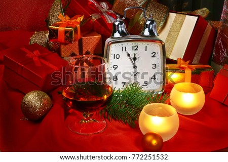 Christmas clock and candles. New Year's Decoration with gift boxes, christmas balls and tree. Celebration Concept for New Year.