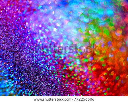 The iridescent, sparkling background