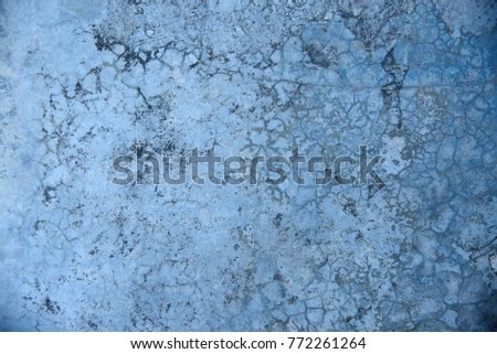 Closeup of cracked concrete texture background. Grunge blue color floor.