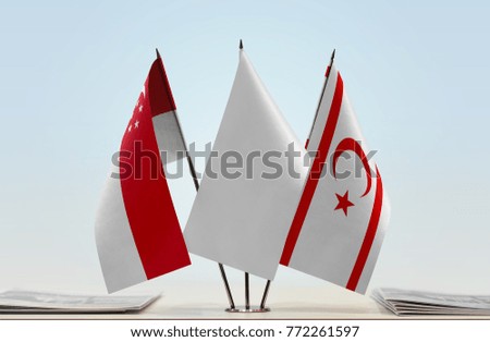 Flags of Singapore and Northern Cyprus with a white flag in the middle