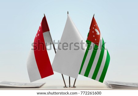 Flags of Singapore and Abkhazia with a white flag in the middle
