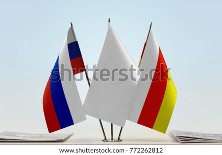 Flags of Russia and South Ossetia with a white flag in the middle