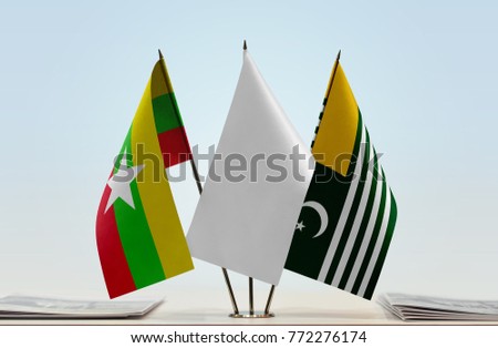 Flags of Myanmar and Kashmir with a white flag in the middle