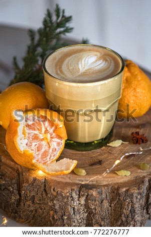 Cappuccino in the green glass and citrus. Winter menu.