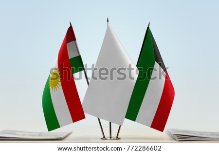Flags of Kurdistan and Kuwait with a white flag in the middle