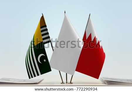 Flags of Kashmir and Bahrain with a white flag in the middle
