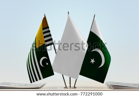 Flags of Kashmir and Pakistan with a white flag in the middle
