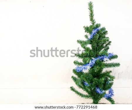 The picture of a small Christmas tree with a copy space. 